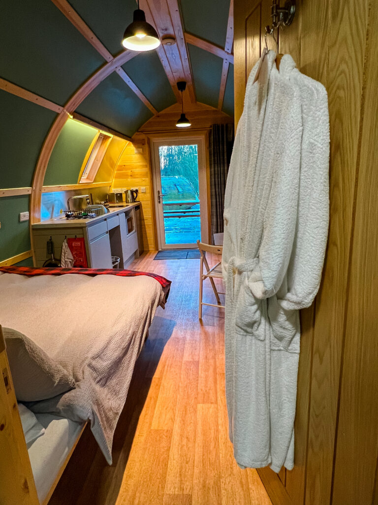 Dressing gowns hanging on the door inside the lodge
